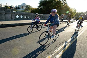 Cyclists ride near the Jefferson Memorial in Washington, DC, as part of the first Eunice Kennedy Shriver Challenge running, walking and biking event